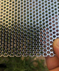 Pro Grade Heavy Duty 19 Gauge Stainless Steel Perforated Metal Sheet 304, 15.7 In x 7.8 In, 3 Mm Holes, held by hand.