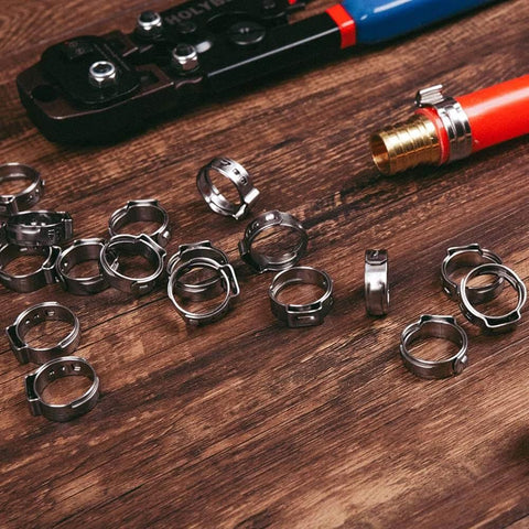 Three Quarters Inch PEX Cinch Clamp Rings in Premium 304 Stainless Steel Thickened Design for 360 Degree Watertight Seals displayed on table