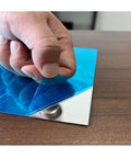 Peeling protective film off 430 Stainless Steel Magnetic Mounting Plates 12 x 6 Inches 0.5mm Thick Mirror Finish for Kitchens and Offices