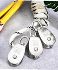 3pcs Stainless Steel Pulley Single Block Heavy Duty Cable Pulley for Rope Swivel Roller with ropes in background.