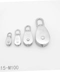 Four sizes of 35kg stainless steel pulley single sheaved capacity movable pulley block wheel swivel on white background.