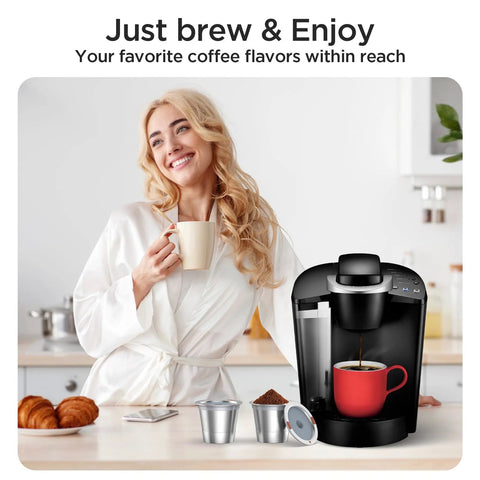 Woman enjoying coffee with Keurig machine and universal stainless steel reusable K cups for Keurig 1.0 and 2.0 machines on kitchen counter.