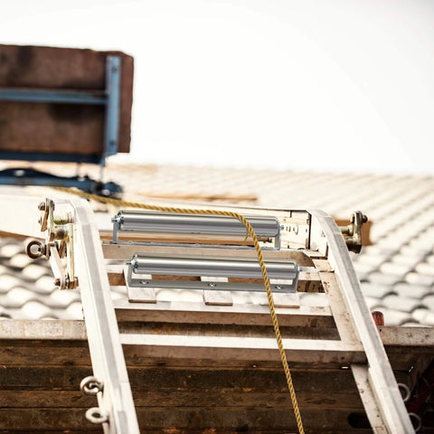 1.5" Diameter Stainless Steel Roller with Bracket Set, 11.8" BF Length, 2-Pack, installed on a ladder for smooth transport use