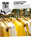 Display of stainless steel round tubes used for pipeline connection, with yellow and white clothes hanging on a wooden rail.