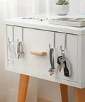 Two Pack Stainless Steel S Hooks No Drill Multipurpose Hanging Hooks holding keys and accessories on a white cabinet