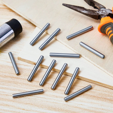 Stainless Steel Shelf Dowel Pins 5mm By 40mm, 32 Pack, Anti Rust Shelf Support Pegs on wooden surface with tools