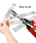 Person cutting Pro Grade 30 Piece Shim Stock Set In 304 Stainless Steel for kitchen and home projects, visible strips in hand