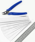 10Pcs Stainless Steel Shim Stock Set For DIY Auto Repairs And Machinery, shown with clippers and ruler for scale and precision.