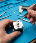 Person using Shim Washers Stainless Steel 3x5 Precision Spacer Kit For Bearings Gearboxes CNC And RC Tuning Assortment