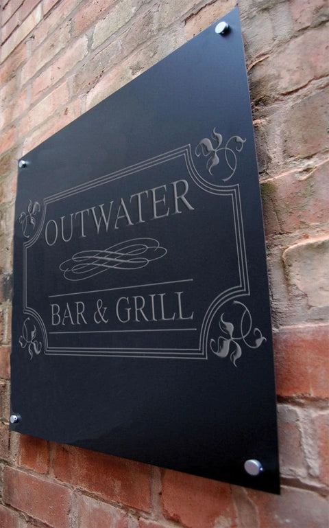 Stainless Steel Sign Standoff Set One Half Inch Diameter And One Half Inch Barrel Length Brushed Finish For PVC Glass And Acrylic Sign Mounts Includes Flat Head Screws And Drywall Anchors Ideal For Indoor Commercial Displays Pack Of Twenty installed on brick wall holding "Outwater Bar & Grill" sign.
