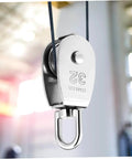 Close-up of a mounted 3pcs Stainless Steel Pulley Single Block Heavy Duty Cable Pulley for Rope Swivel Roller.