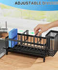 Compact rustproof 304 stainless steel sink caddy with rotatable spout and tall brush holder on kitchen counter with sponges.