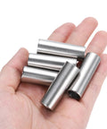 Hand holding five Heavy Duty Stainless Steel Spacer Set 3/8 Bore 1/2 OD 1-1/2 Inch Length For 3/8 Screws Bolts And Rods 304