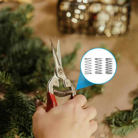 Hand using scissors with inset image showing 'Stainless Steel Compression Springs Assortment Kit With 240 Pieces In 15 Different Sizes'