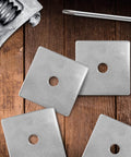 Premium 304 stainless steel square washer plates, 2.4 inch outer diameter, 3 mm thick, 3/8 inch bore on wood surface