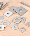 Stainless Steel Square Washer Plate Set For M8 Bolts 20x20mm 2mm Thick With 8mm Inner Diameter Ten Pack displayed on wooden surface