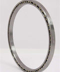 Stainless Steel SSVA055CP0-1RS Thin Section Bearing 5-1/2" x 6" x 1/4" One Seal side view showing brass cage and smooth finish.