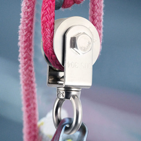 Close-up of 2 Pack V Type Swivel Pulley With 304 Stainless Steel Double Ball Bearing in use with pink rope, corrosion-resistant design