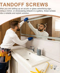 Person installing mirror with Gold Tone M4x0.7 Sign Standoff Screws With Spacers 8 Pack Wall Mount Hardware for Acrylic Glass Signs