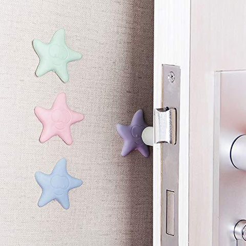 Starfish-shaped silicone bumpers protecting wall from door handle, self-adhesive installation showing in pastel colors