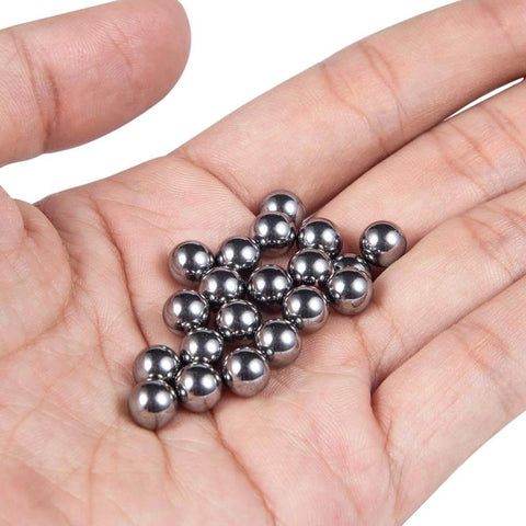 Steel balls held in hand, components for ✝️ 600-Pack Utility Cart Steel Frame Built for Moving Boxes, Appliances, and Heavy Cargo.