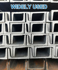 Stack of metal beams labeled 'Widely Used' showcasing industrial applications.