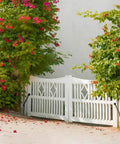 Heavy Duty 11 Inch Gate Spring Self Closing Black Steel Outdoor Gate Closer on white wooden fence in garden