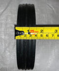Close-up of 7 Inch By 1.5 Inch Steel Ball Bearing Wheel For Power Trim Edger Replacement OEM Part 332 with tape measure