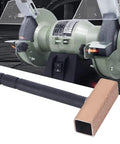 Stone Dresser Disc Wheel Abrasive Tool With Anti Slip Handle placed in front of a grinding machine showing use for surface refinement.