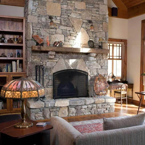 Stone fireplace with 18001 Tall 5 Pc Lodge Heavy Duty Fireplace Set in Matte Black Finish, including tools and stand visible.