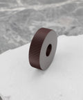 Close-up of single P1.0mm straight knurling wheel, 28x8x8mm steel roller, for knurling tools and lathe holders in metalworking.