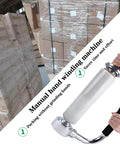 Industrial Stretch Wrap Dispenser With Built In Cutter For Easy Pallet Wrapping Adjustable 12 To 20 Inch Handle Heavy Duty Stretch Film Dispenser Holder For Efficient Packaging And Secure Goods On Every Load next to pallets wrapped in plastic film.