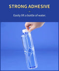 Clear Double Sided Adhesive Pads For Wall Mounting Ultra Strong Sticky Dots lifting a full water bottle