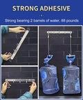 Heavy Duty Double Sided Mounting Tape For Walls And Decor Clear 20 Ft Long By 1.2 In Wide Ultra Strong Adhesive Yet Removable With No Mess Or Damage Perfect For Posters Frames Decor And Lightweight Items shown holding two large water barrels