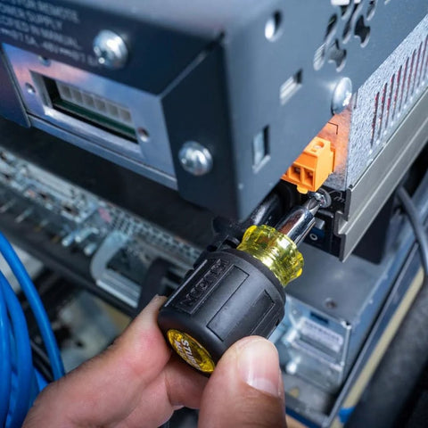Using a 6-In-1 Stubby Screwdriver and Nut Driver with interchangeable shaft in an electrical panel