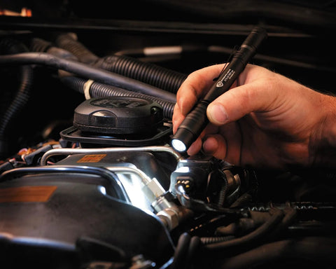 Stylus Pro 100-Lumen Penlight delivers reliable brightness for everyday carry with a compact pocketable design in use in vehicle engine