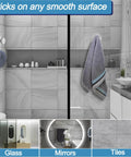 Suction Cup Hooks for Glass and Tile No Drill Shower Hooks Silver 2 Pack installed in a bathroom holding a towel on glass surface