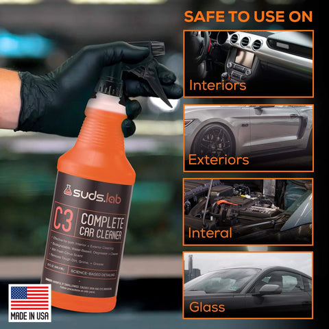Suds Lab C3 Complete Car Cleaner bottle held by gloved hand, suitable for interiors and exteriors shown in image.