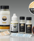 Various Sunshine Products including adhesives and tapes for wig and hair system application, with visible labels and sizes.