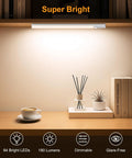 10.2 Inch Under Cabinet Lighting Kit installed on shelf, bright 84 LED light illuminating books and decor, motion sensor visible