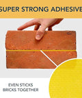 Super strong adhesive sticking two bricks together, demonstrating the Two Sided Rug Tape Heavy Duty Grip That Keeps Rugs Put, 90 Feet Long, 1.88 Inches Wide, Ultra Sticky Adhesive For Concrete, Tile, Hardwood, Laminate, Indoor And Outdoor Use, Runners, Mats, And Area Rugs.