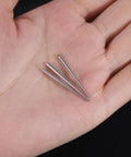 Three surgical steel piercing tapers in hand from Twelve Piece Surgical Steel Piercing Taper Set 20G 18G 16G 14G External Threaded.