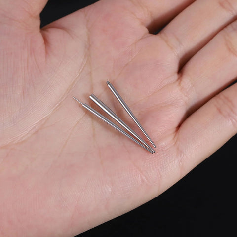 Three surgical steel piercing tapers in hand from Twelve Piece Surgical Steel Piercing Taper Set 20G 18G 16G 14G External Threaded.