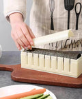Using Complete Sushi Making Kit With 3 Shape Molds Rice Roller Tool And Spatula for restaurant-style sushi at home.