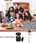 Family at dining table using two pack quarter inch swivel mini ball head tripod mount with camera, suitable for digital cameras.
