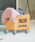 Wooden storage cart with 24 pack 2 inch swivel plate caster wheels with blue polyurethane, featuring a pink blanket.