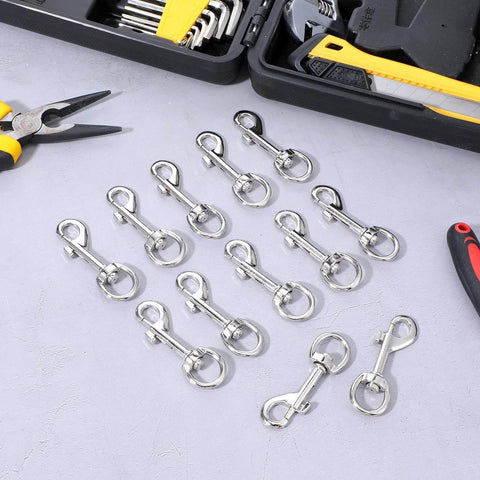 Fifty Pack Swivel Snap Hooks for Dog Leash Heavy Duty 2.68 Inch Flag Clasp displayed on tabletop next to tools