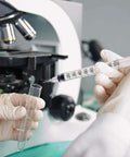 Lab technician using 30 Pack U100 Syringes 1Ml 30G 5 Sixteenth Inch Needles Disposable Individually Wrapped For Precise Liquid Measurement