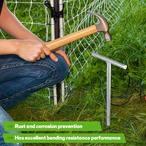 Installing 2 Pack 36 Inch T Handle Galvanized Ground Rod with hammer near electric fence, for industrial power setups and chemical industry use.