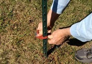 Installing Patented T Post Hinge Pins For Easy Gate Hanging From Metal T Posts Made In USA in outdoor setting